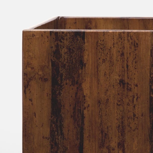 Close-up of Pigeon & Poodle Varadero bath canister corner in warm tortoiseshell lacquer finish.