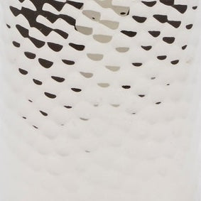 Close-up of Pigeon & Poodle Verum bath canister showing white textured surface pattern.