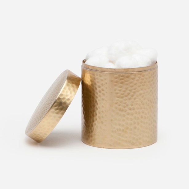 Pigeon & Poodle Verum canister open lid, showing hammered gold finish and cotton balls inside.