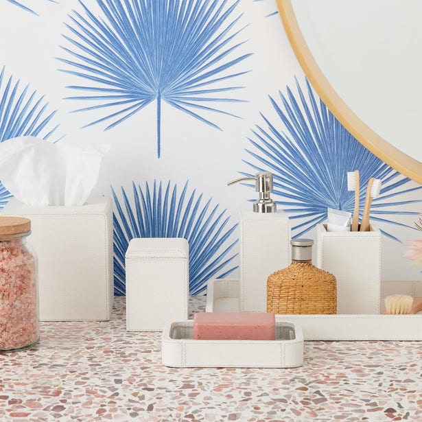 White Pigeon & Poodle Victoria soap pump in styled bathroom with tropical wallpaper backdrop.