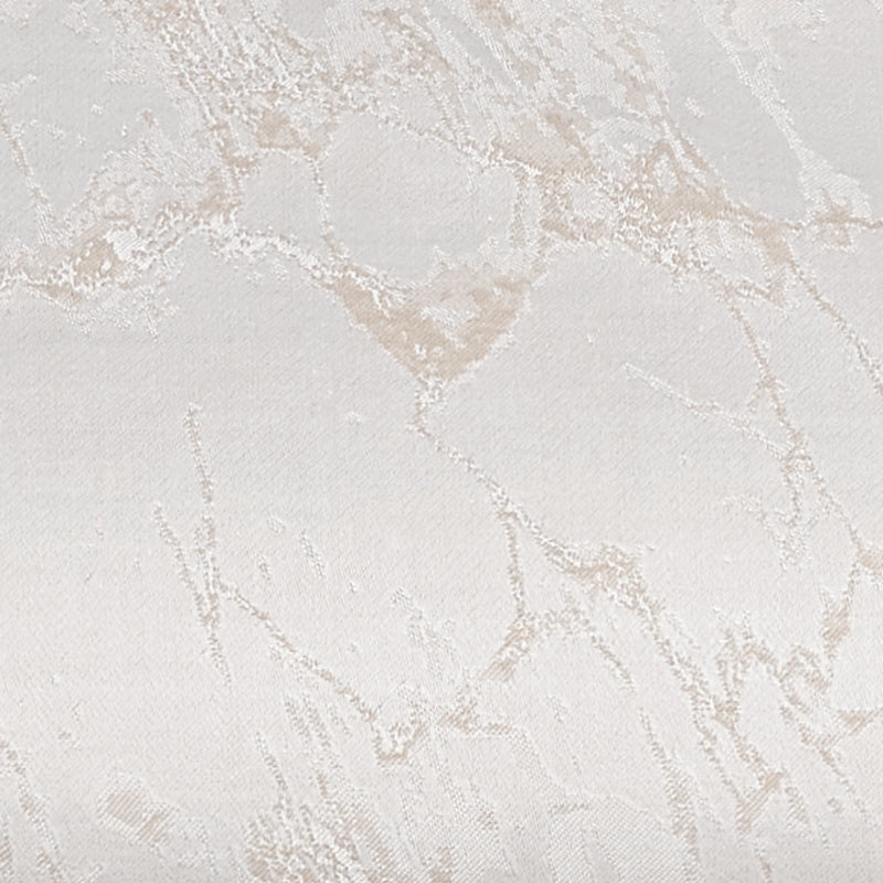 Close-up of ivory jacquard fabric with champagne marble-effect woven pattern.