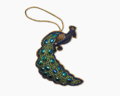 Henry Handwork beaded peacock ornament in sapphire and teal with gold cord hanger.