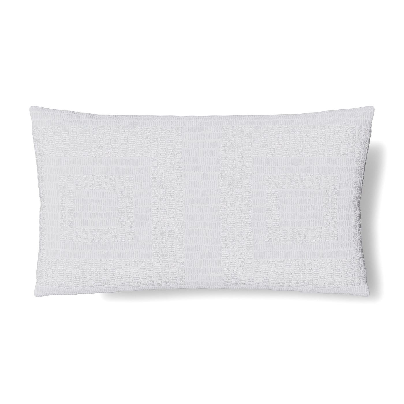 Ann Gish Piastrella lumbar pillow in white with subtle woven texture, isolated on white.