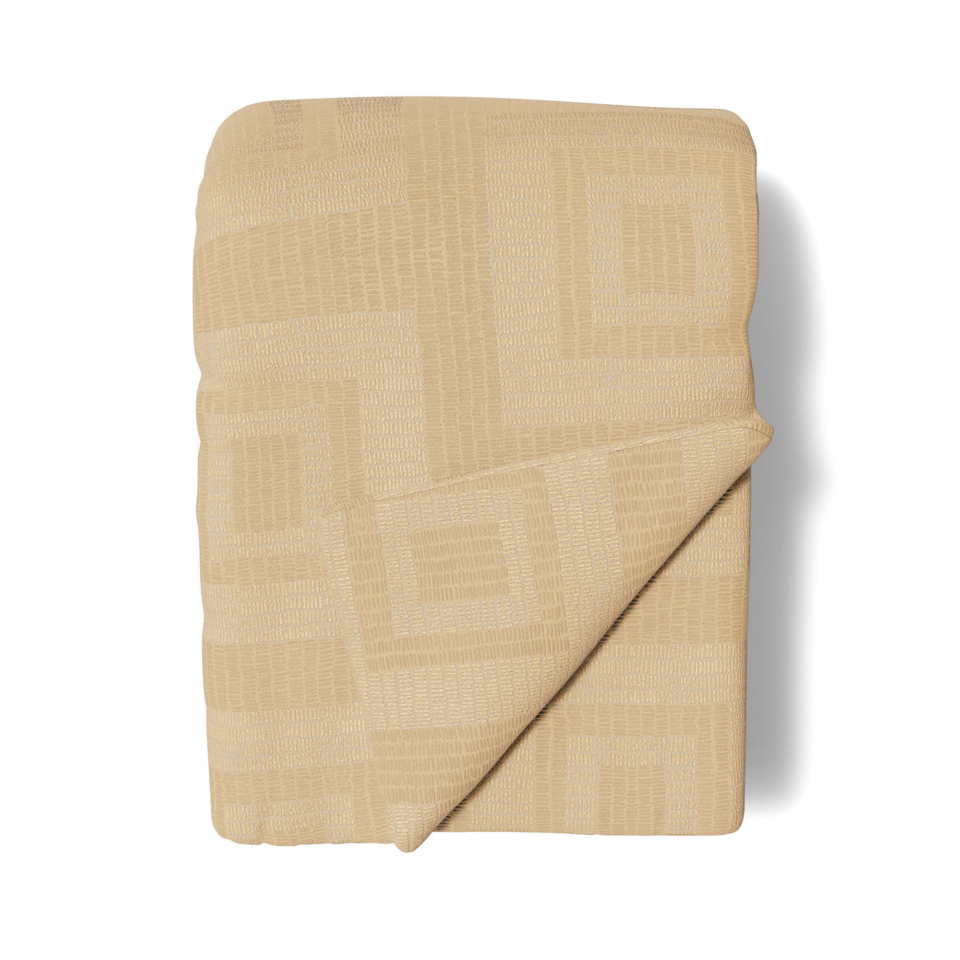 Close-up of folded Ann Gish Piastrella throw in champagne with geometric tile-pattern weave.