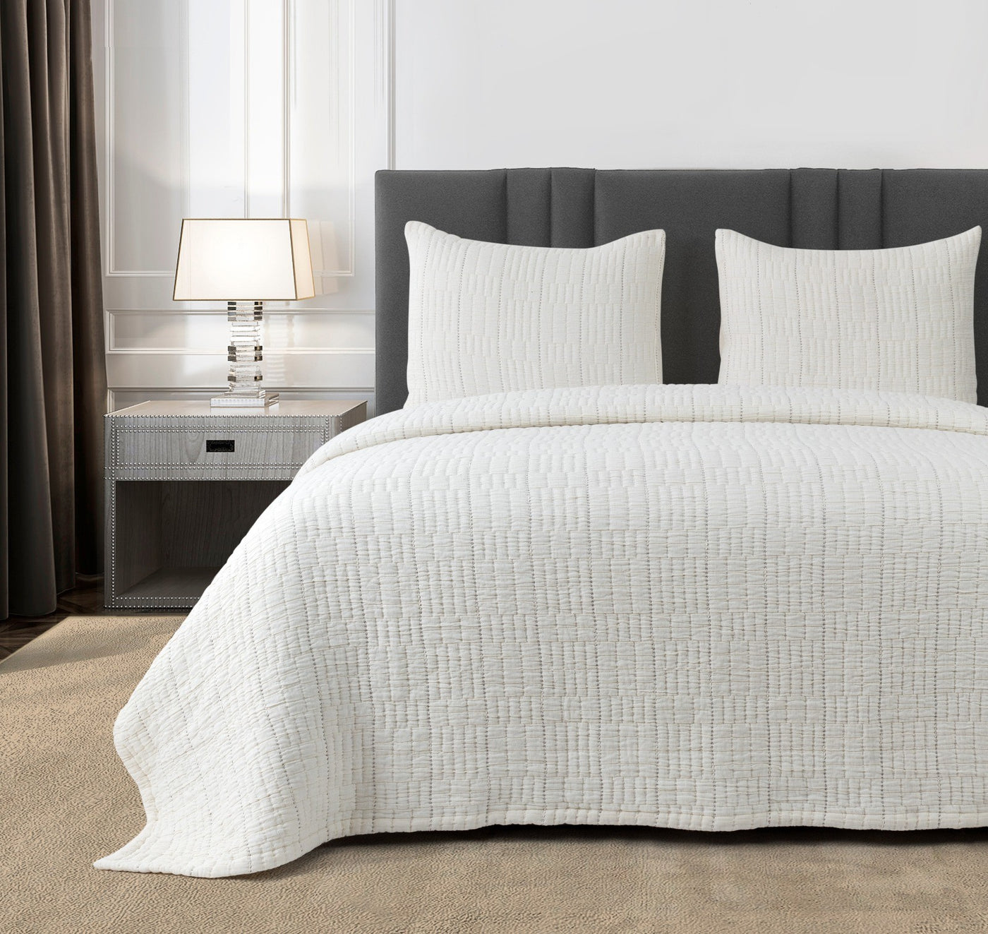Ann Gish Pickstitch coverlet set in white with textured grid quilting on styled bed.