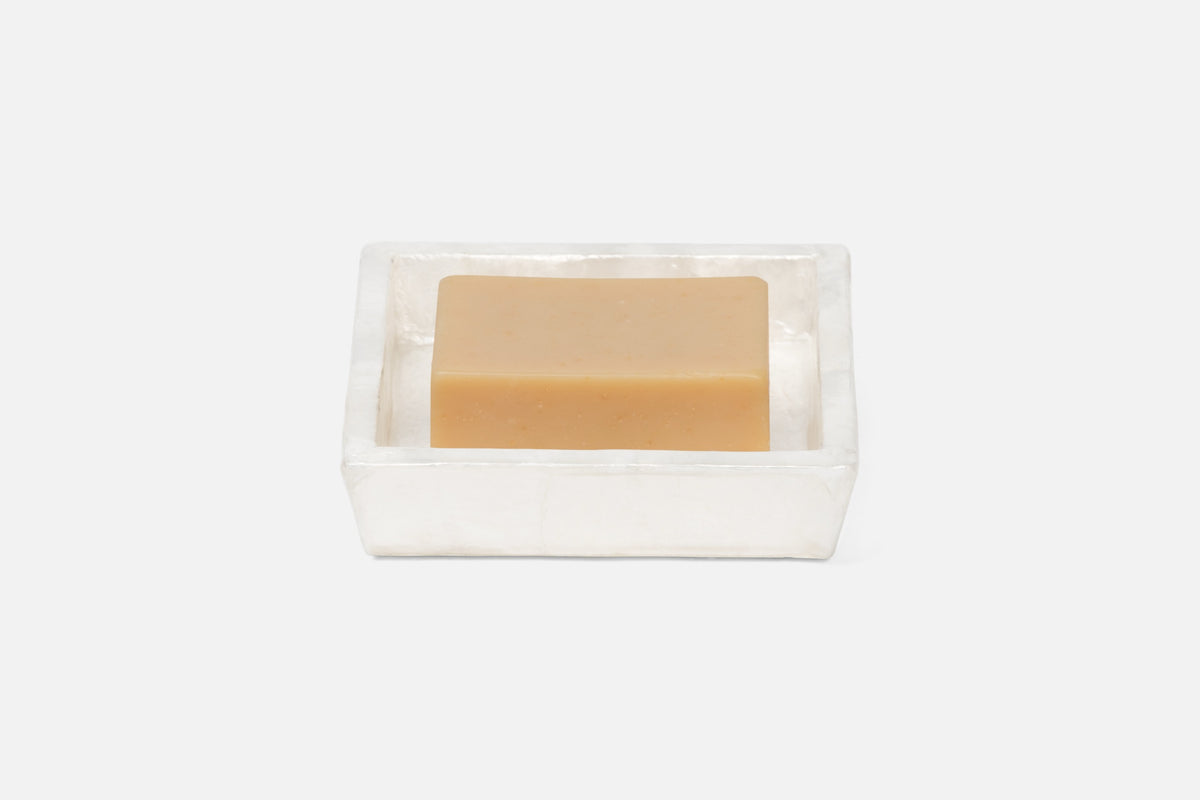 Pigeon & Poodle Andria soap dish in clear acrylic with a honey-toned bar of soap.
