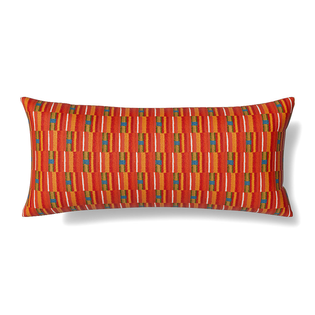 Ann Gish Pluma lumbar pillow in red with multicolor woven geometric stripe pattern.