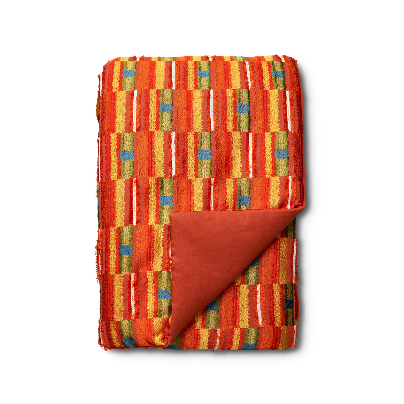 Close-up of Ann Gish Pluma throw corner, showing rust lining against vibrant orange woven stripe pattern.