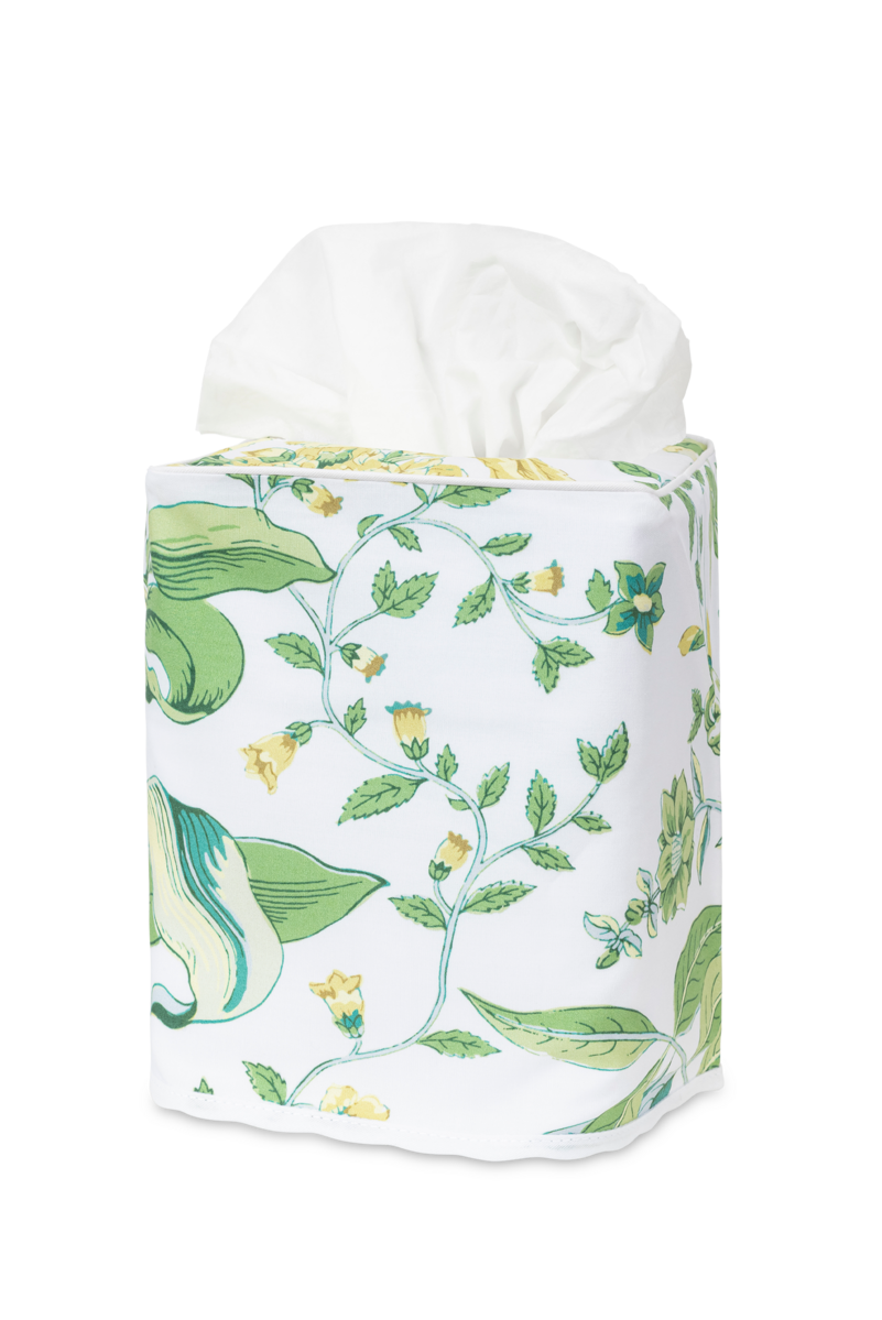 The Matouk Pomegranate Tissue Box Cover features white Egyptian cotton percale with a green and yellow floral pattern, inspired by botanical bedding.
