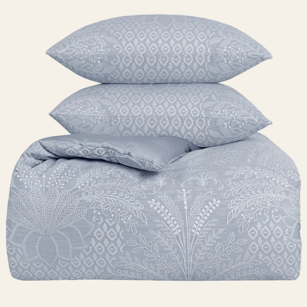 Ann Gish Printemps comforter set in slate blue with floral and geometric jacquard pattern.