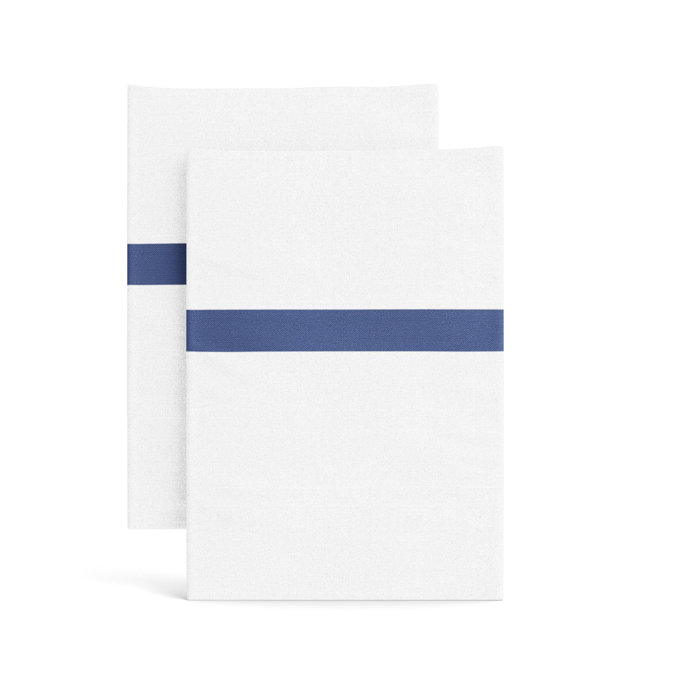Two white cotton pillowcases with a bold indigo trim stripe, folded and stacked.