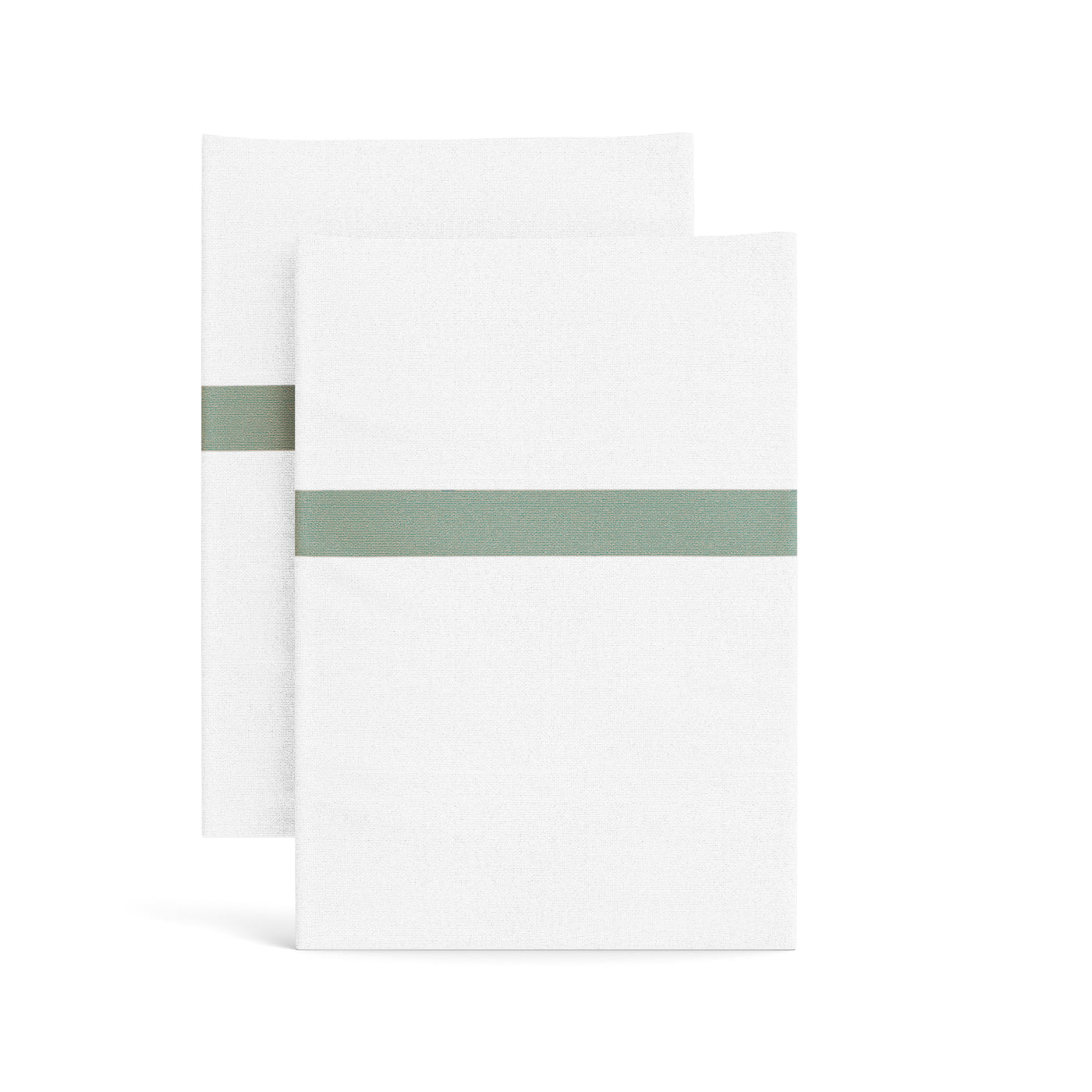 Close-up of two white waffle-weave pillowcases with a sage green stripe trim, folded flat.