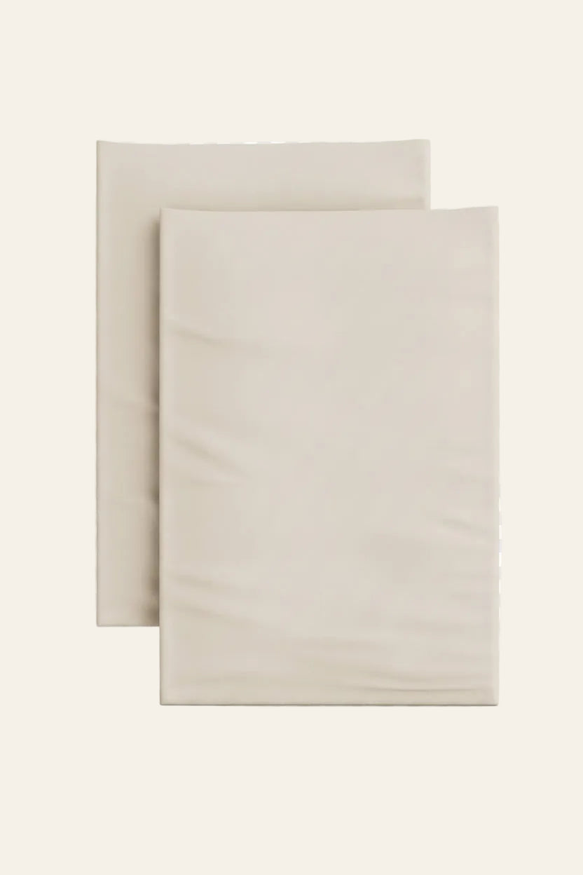 Ann Gish Ready-to-Bed 2.0 fitted sheets in ivory, pair shown flat against white background.