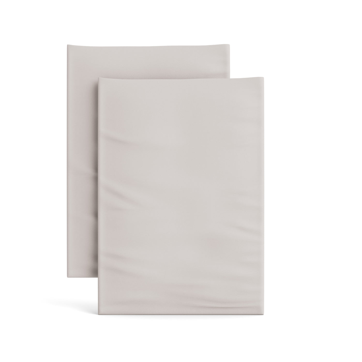 Two Ann Gish Ready-to-Bed 2.0 fitted sheets folded flat in pale silver-grey.