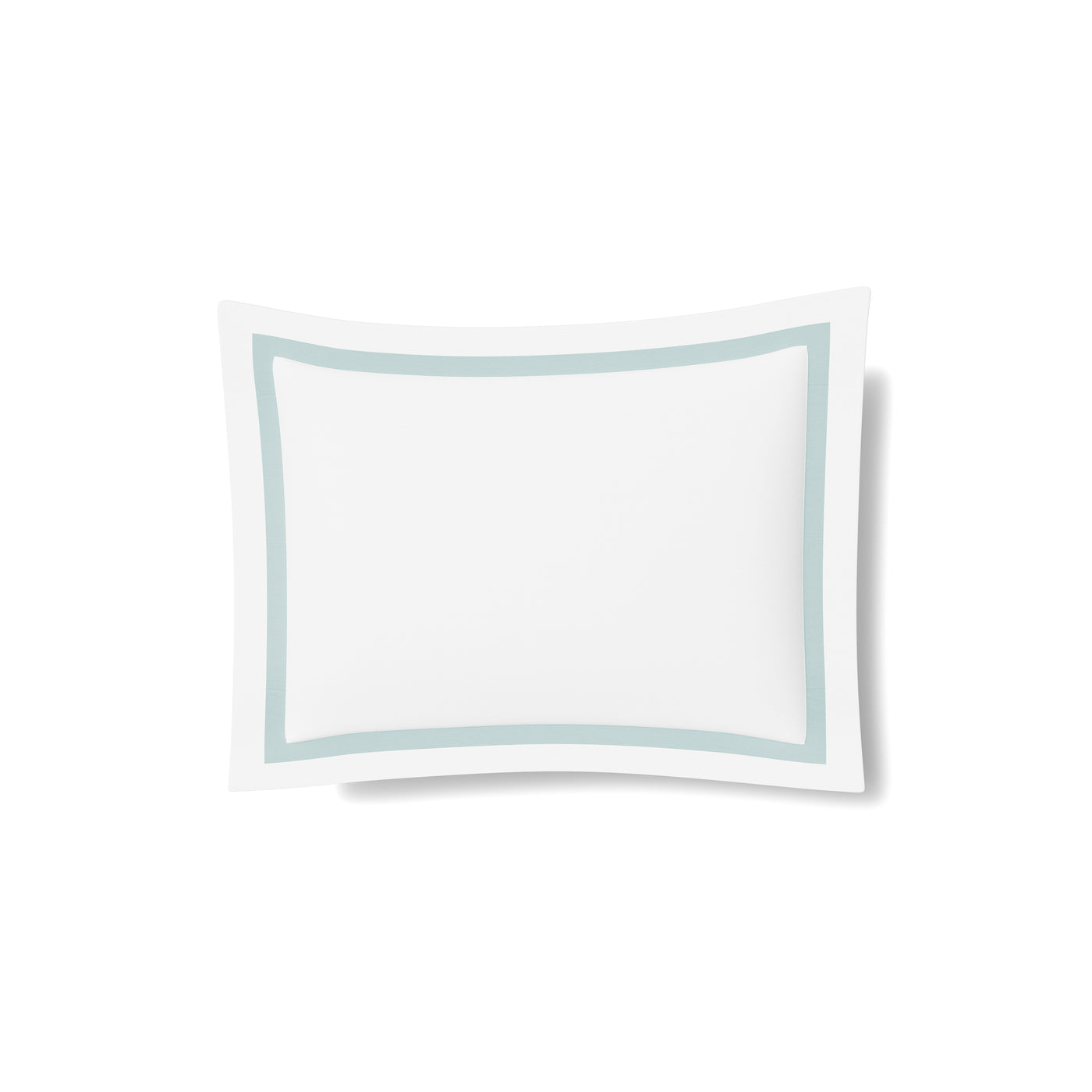 Close-up of white cotton sham with seafoam trim border detail.