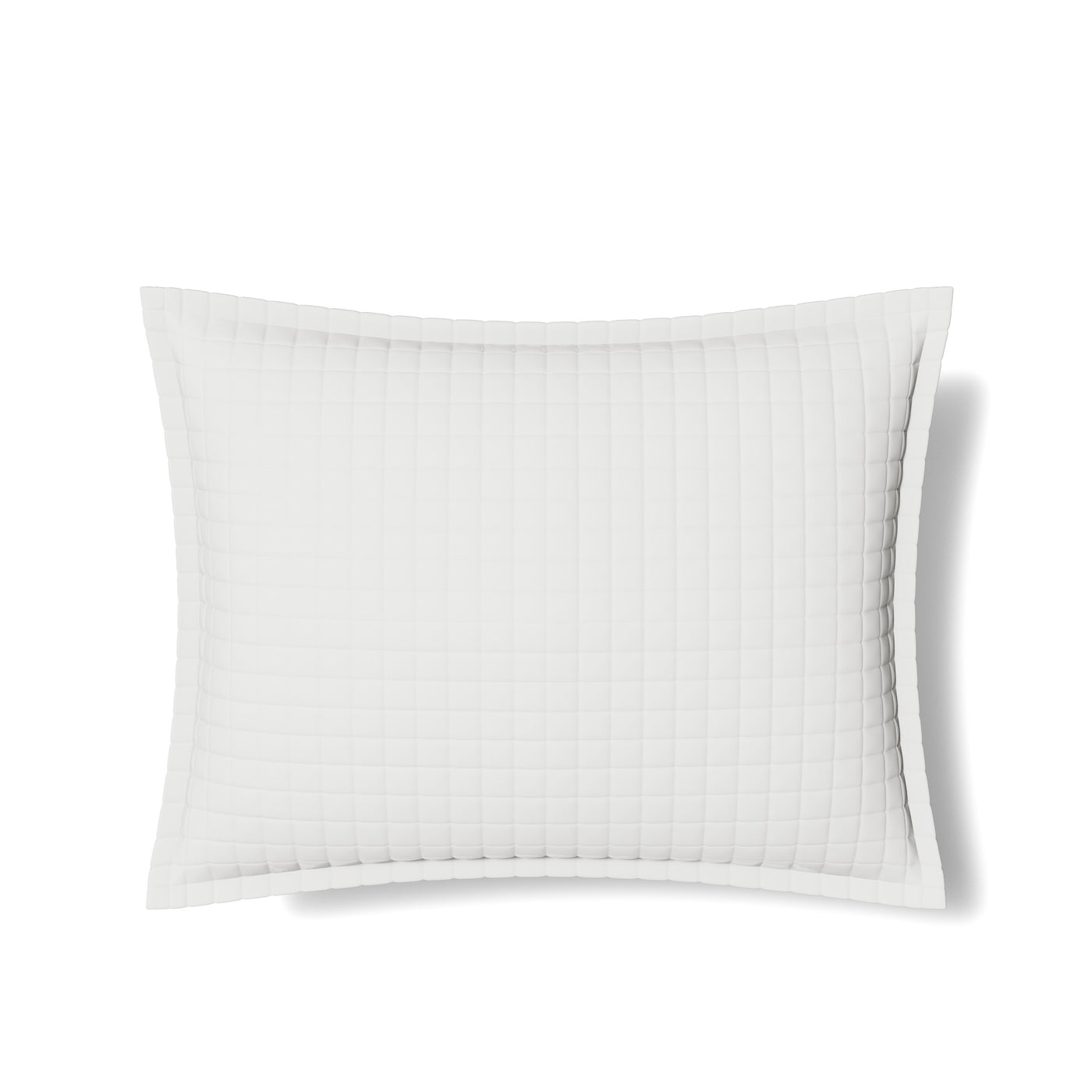 Ann Gish quilted ivory sham with grid stitching and flanged border, flat lay.