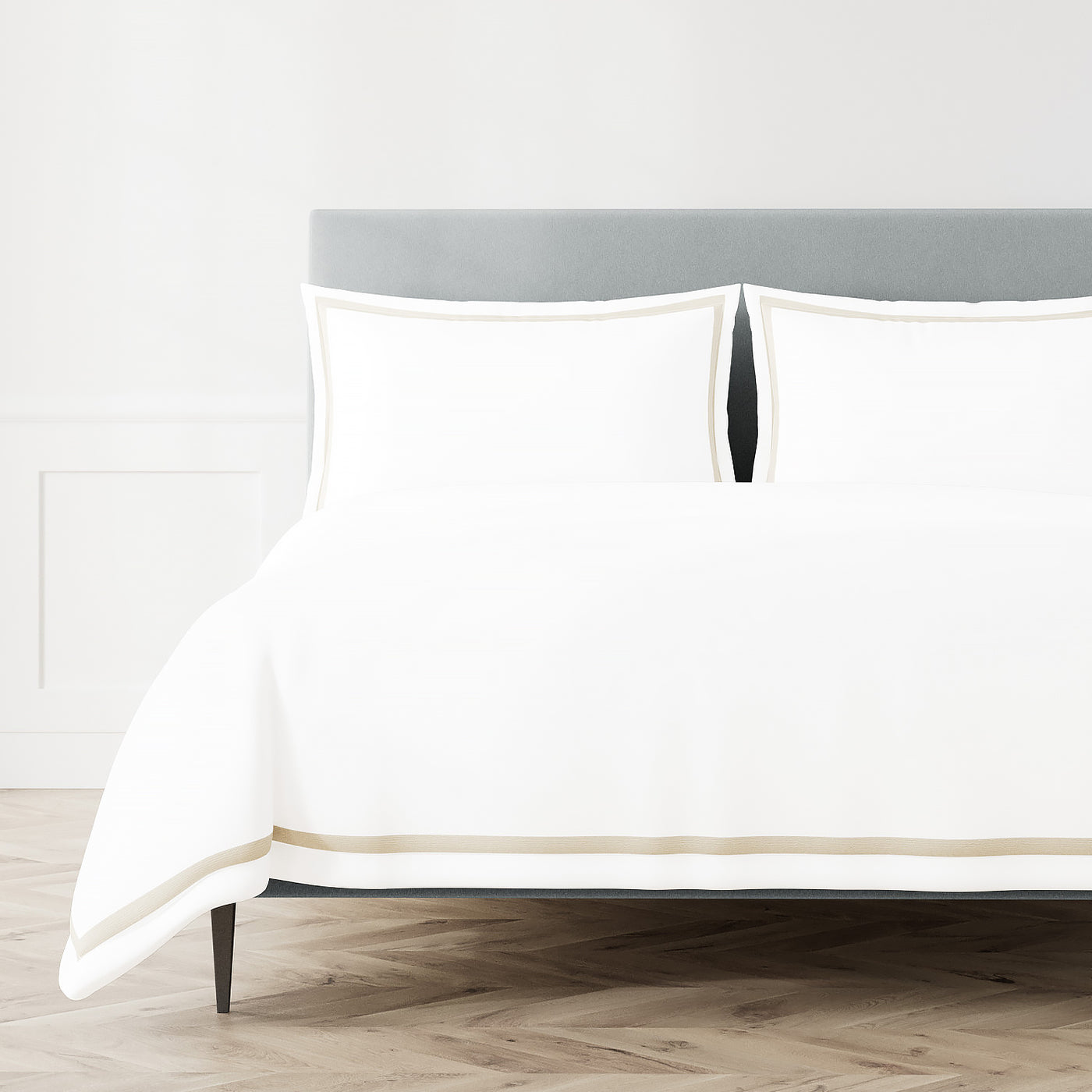 White Ann Gish Ready-to-Bed 2.0 duvet with champagne trim, styled on bed with matching shams.