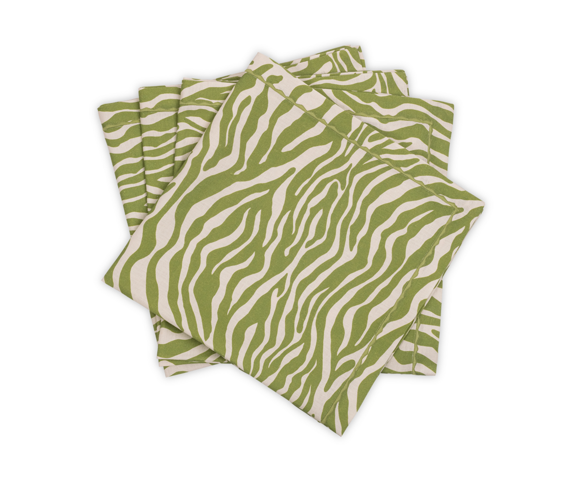 The Regine | Napkin Set by Matouk features four folded green and white zebra-motif cloth napkins, stacked on a white background, from the Schumacher table collection.