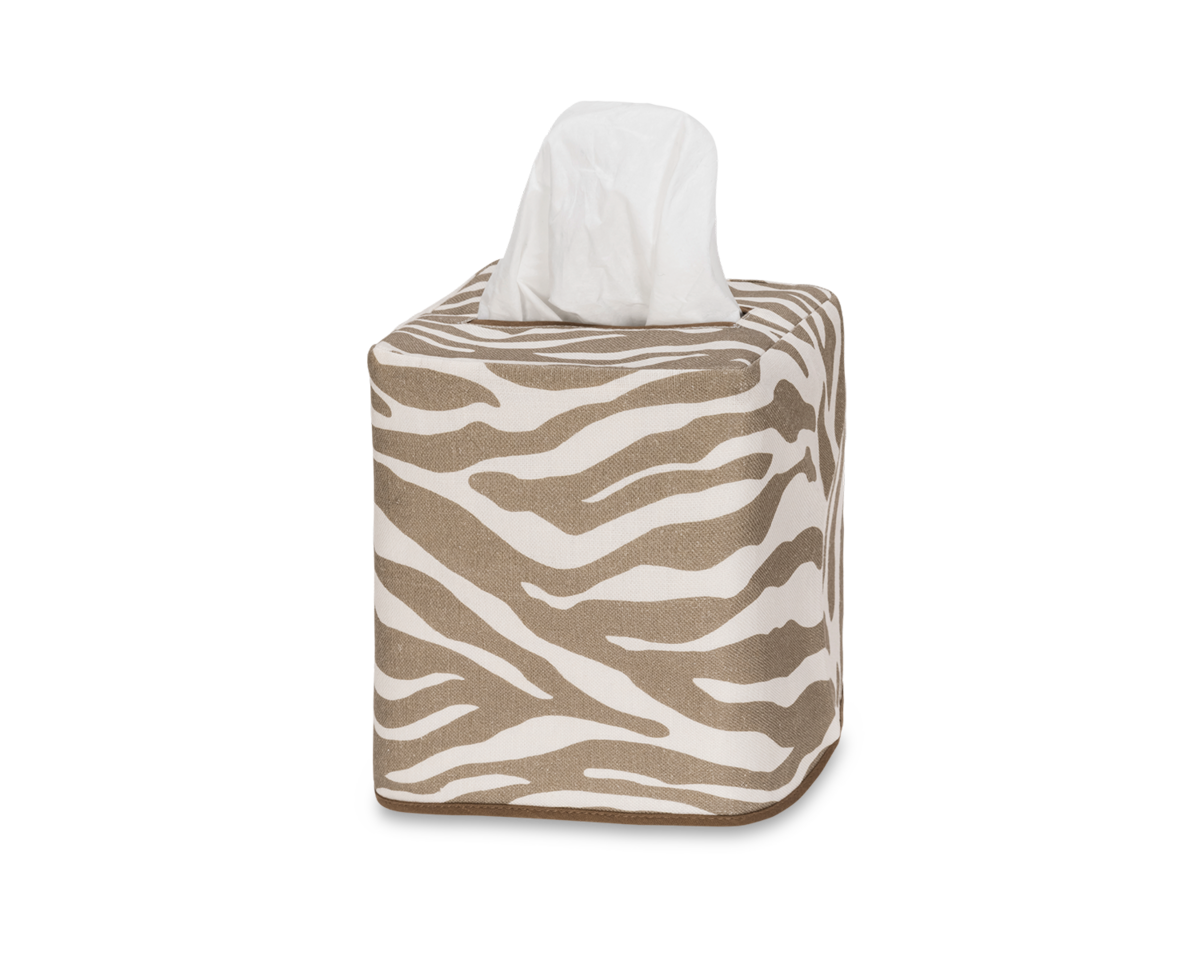 The Regine | Linen Jacquard Tissue Box Cover by Matouk features a brown and white zebra motif, resembling decorative printed linen, with one tissue partly pulled out.