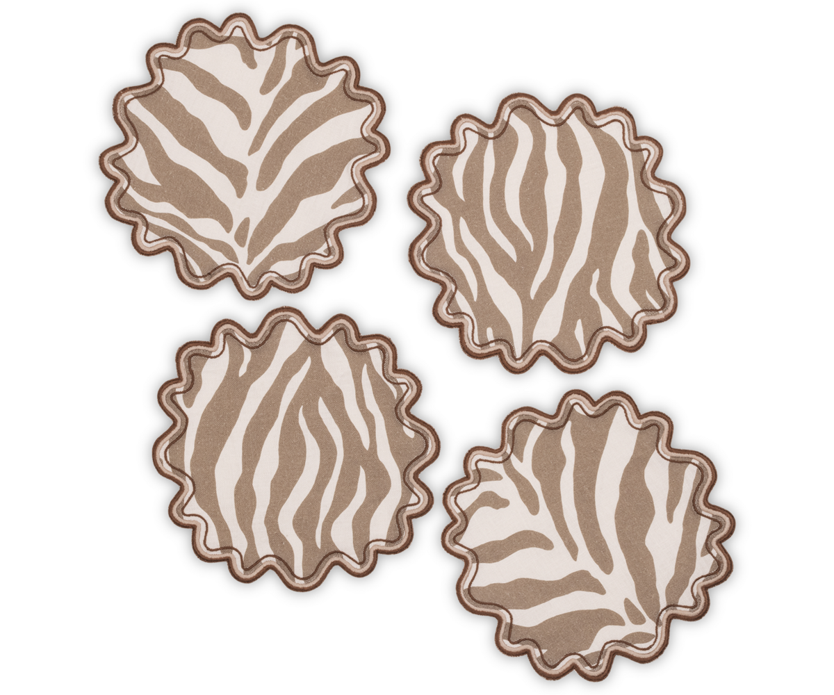 Four Regine Cocktail Napkin Sets by Matouk, featuring a brown and white stylized zebra motif, are arranged on a white background.