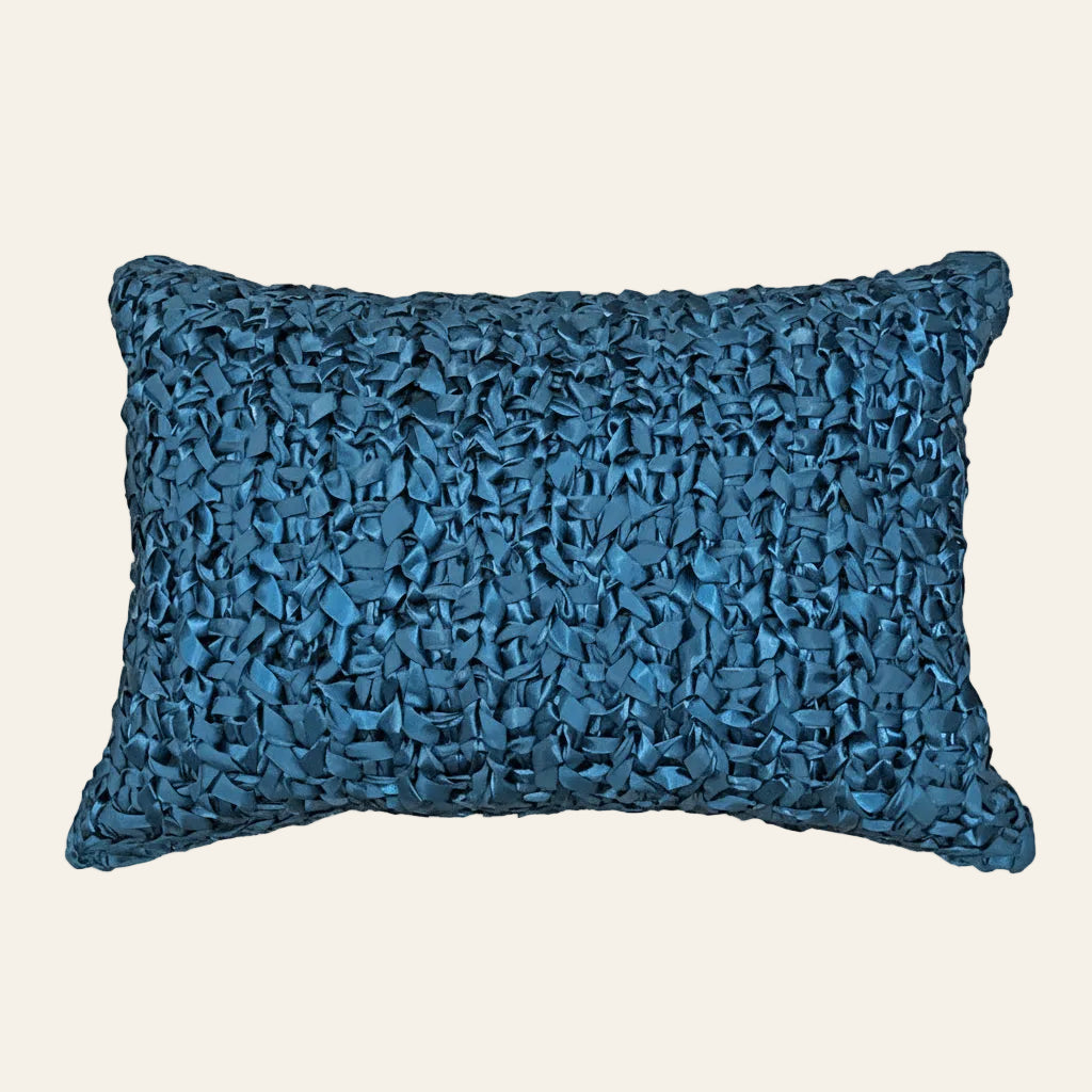 Ann Gish Ribbon Knit pillow in teal with textured woven ribbon surface detail.