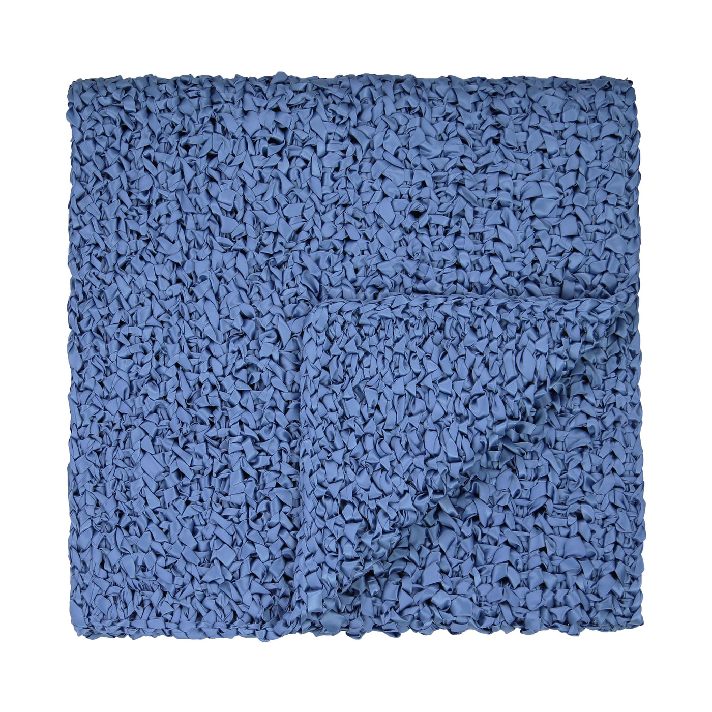 Close-up of Ann Gish Ribbon Knit Throw folded, showing textured cobalt blue weave.