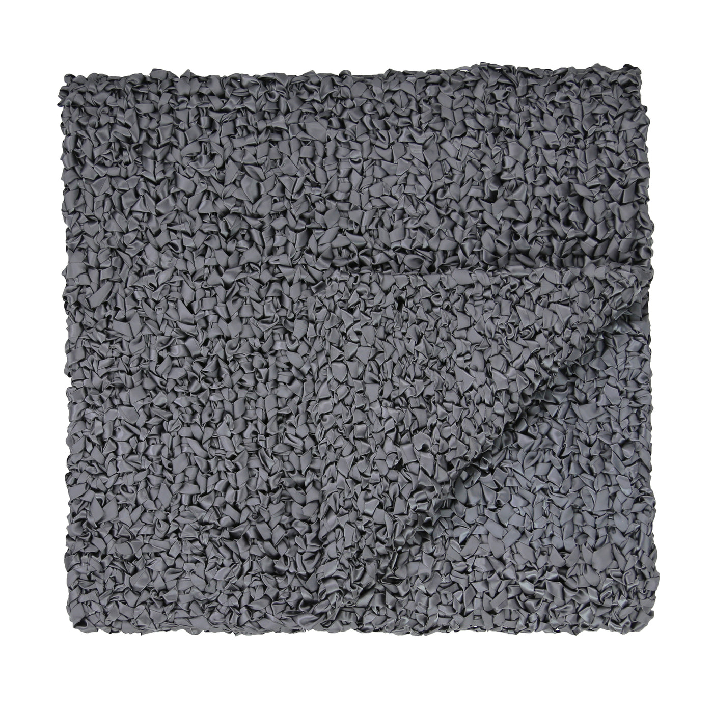 Corner fold detail of Ann Gish Ribbon Knit Throw in charcoal, showing looped texture.
