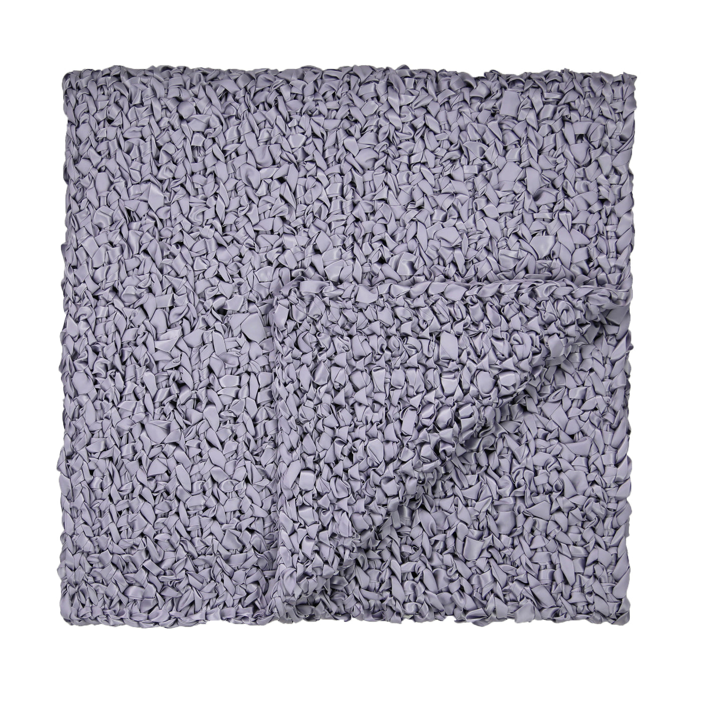 Folded slate ribbon knit throw, chunky looped texture visible across surface.
