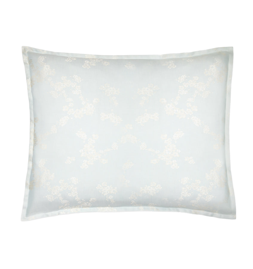 Sferra Salara sham in mist blue with ivory floral jacquard pattern and flanged border.
