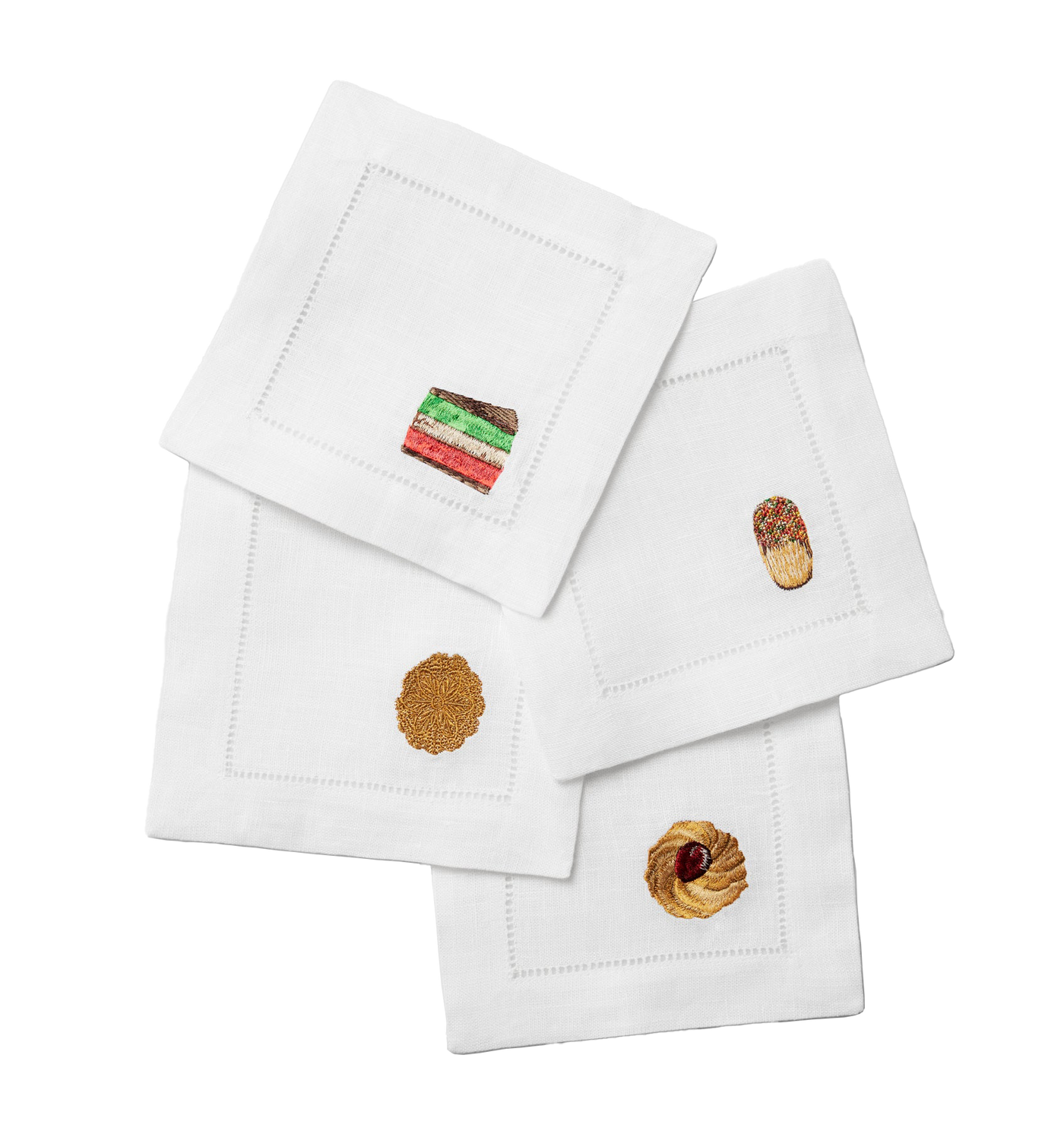 Sferra Biscotto white linen cocktail napkins with embroidered cookie motifs and hemstitch border.