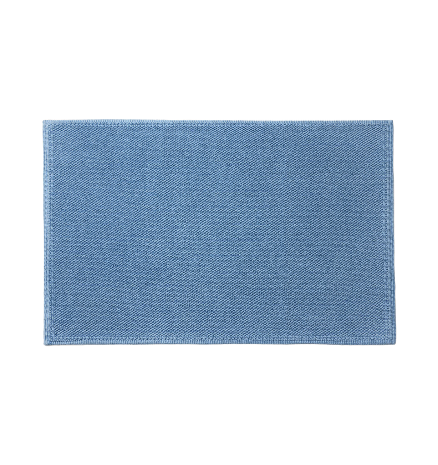 Sferra Osini bath rug in sky blue with a textured woven surface.