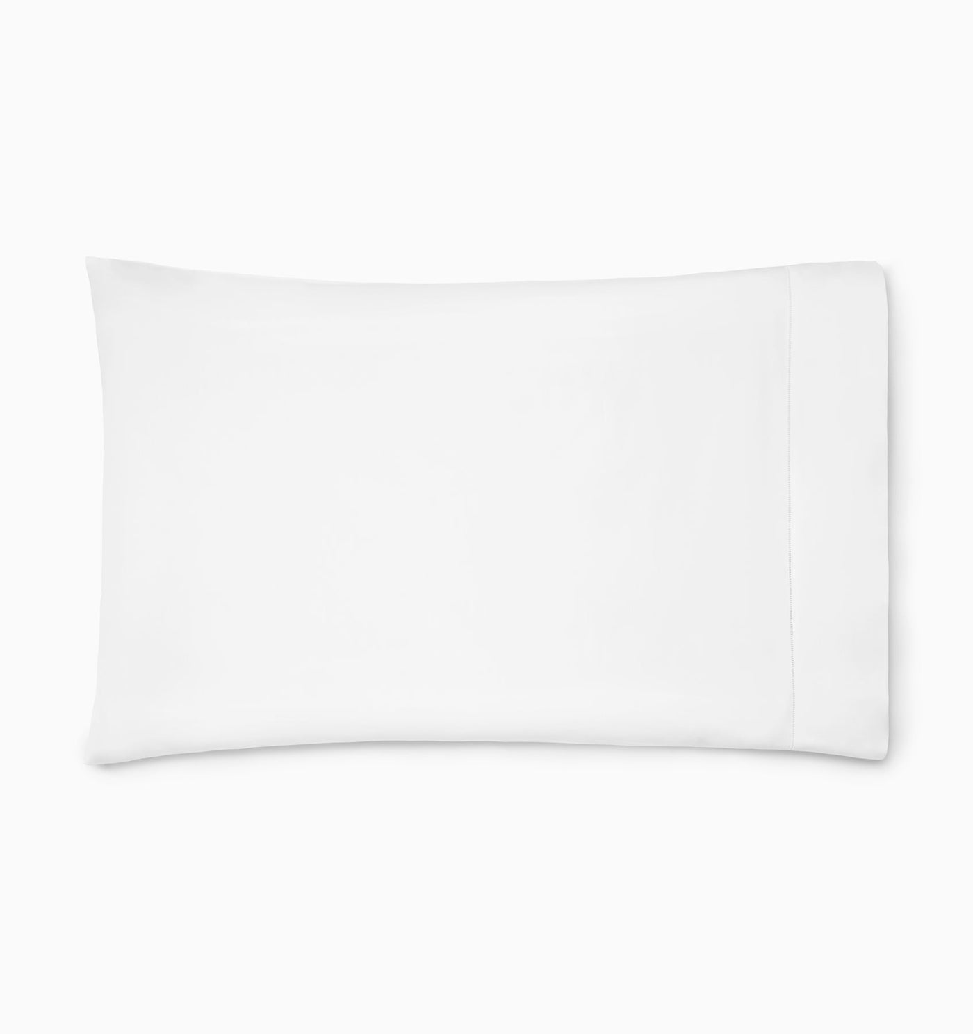 Flat lay of white Sferra Luxor pillowcase showing hemstitch border detail.