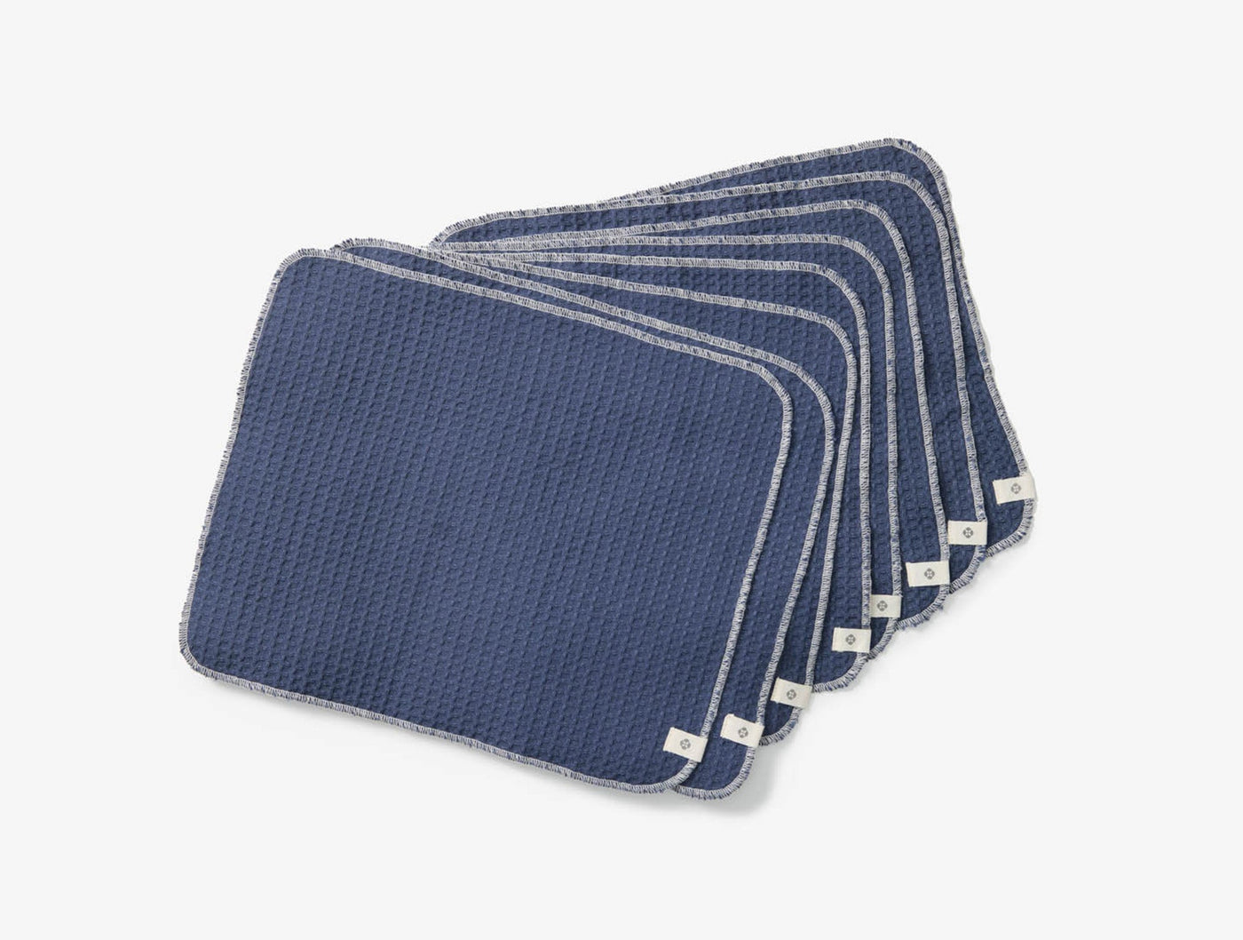 Coyuchi Conserve navy waffle-weave paperless towel set of eight, fanned display.