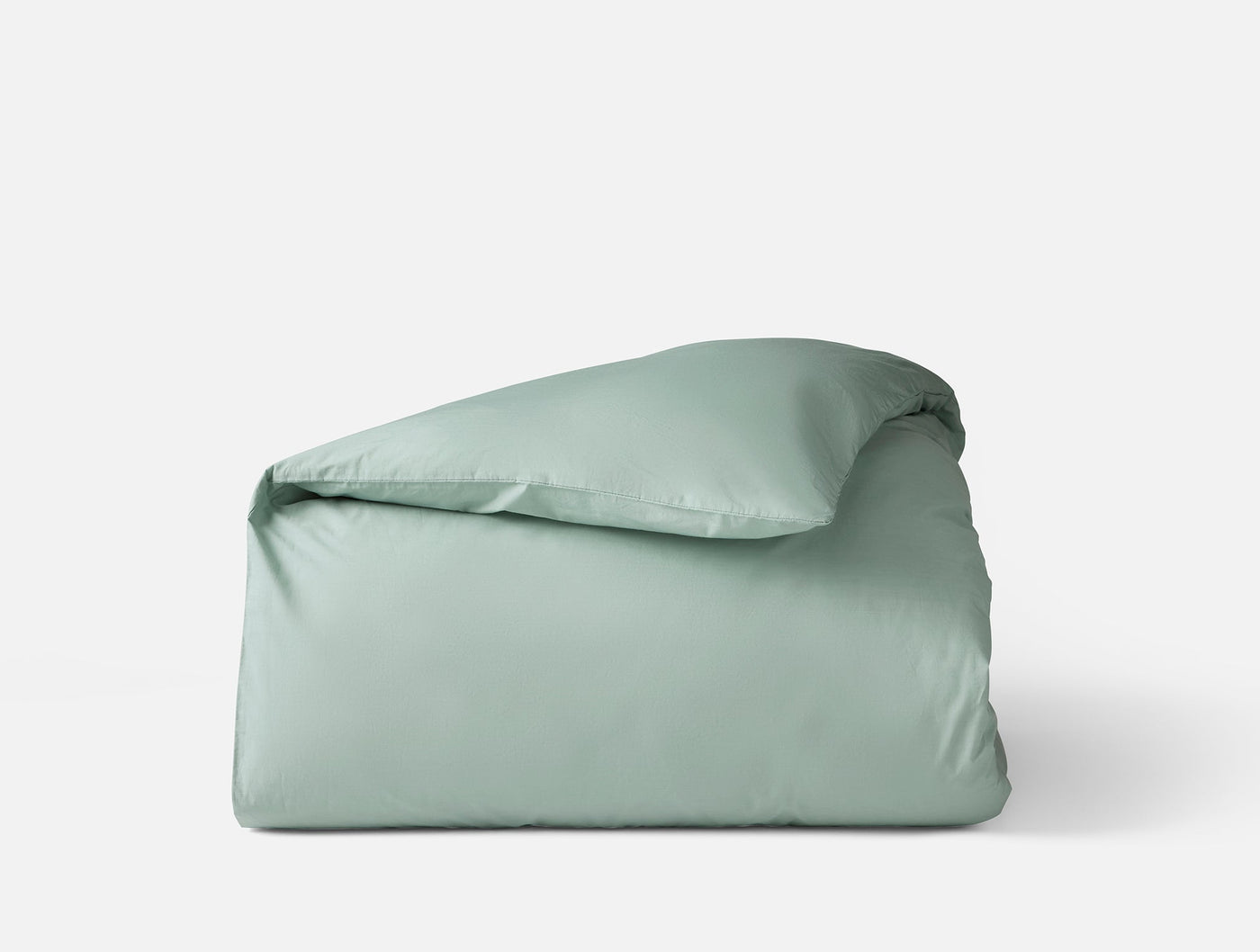 Coyuchi Refined Percale duvet cover folded, sage green percale cotton.