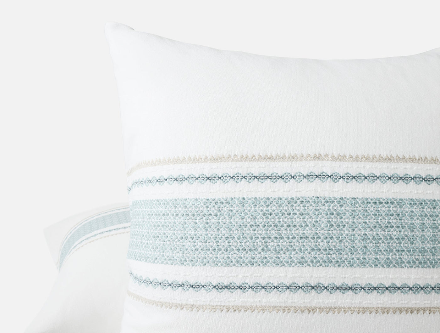 Close-up of Coyuchi Cabrillo sham showing woven stripe detail in soft blue and taupe.