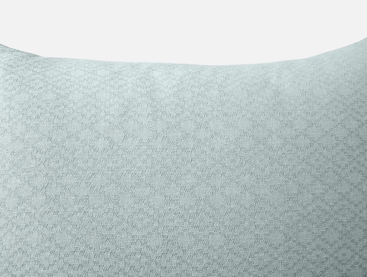 Close-up of Coyuchi Capitola sham in seafoam, showing subtle geometric matelassé texture.