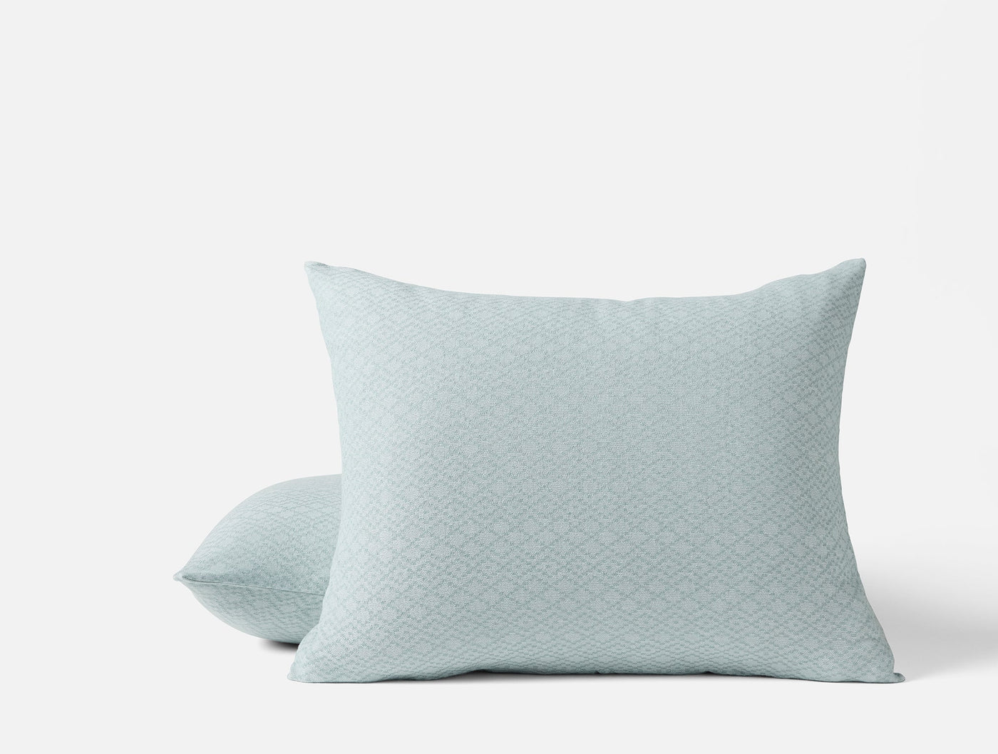 Coyuchi Capitola pillow sham in mist blue with a subtle diamond weave pattern.