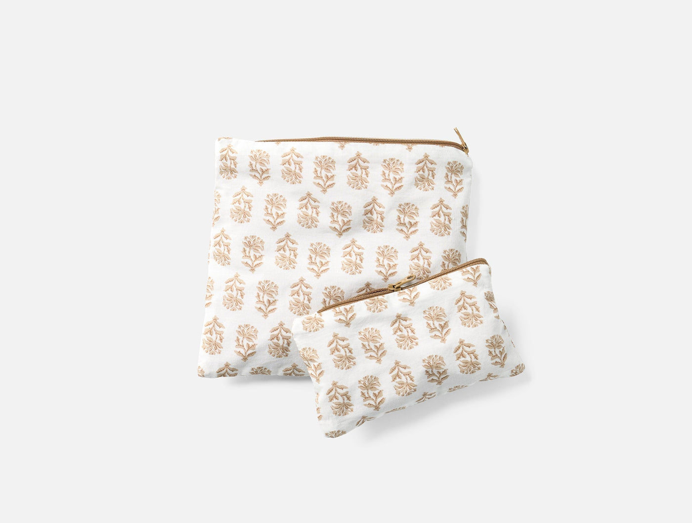 Coyuchi block-printed snack bag set in ivory and tan botanical motif, two sizes.