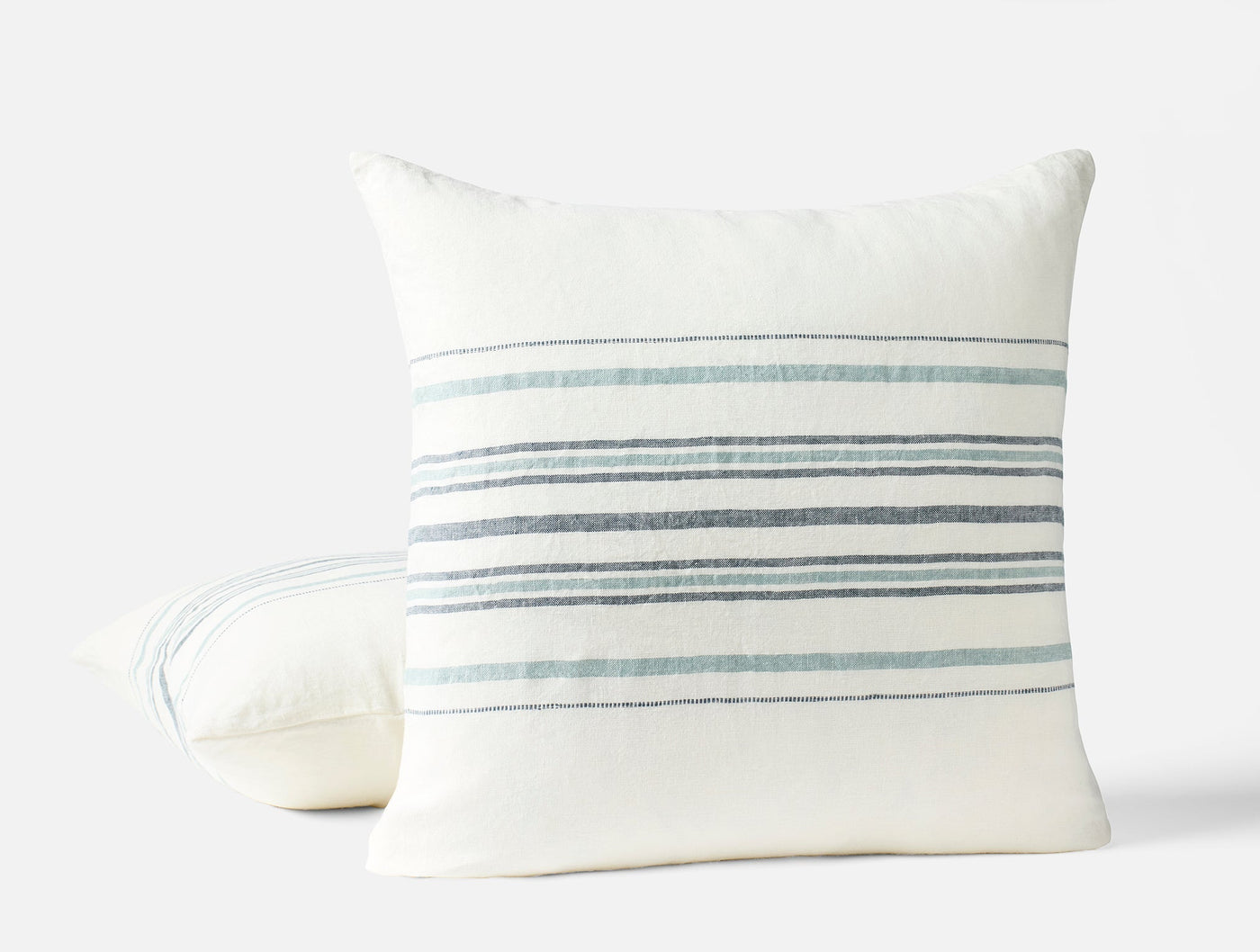 Coyuchi Mojave Linen pillow back and front view, ivory with blue-grey stripes.