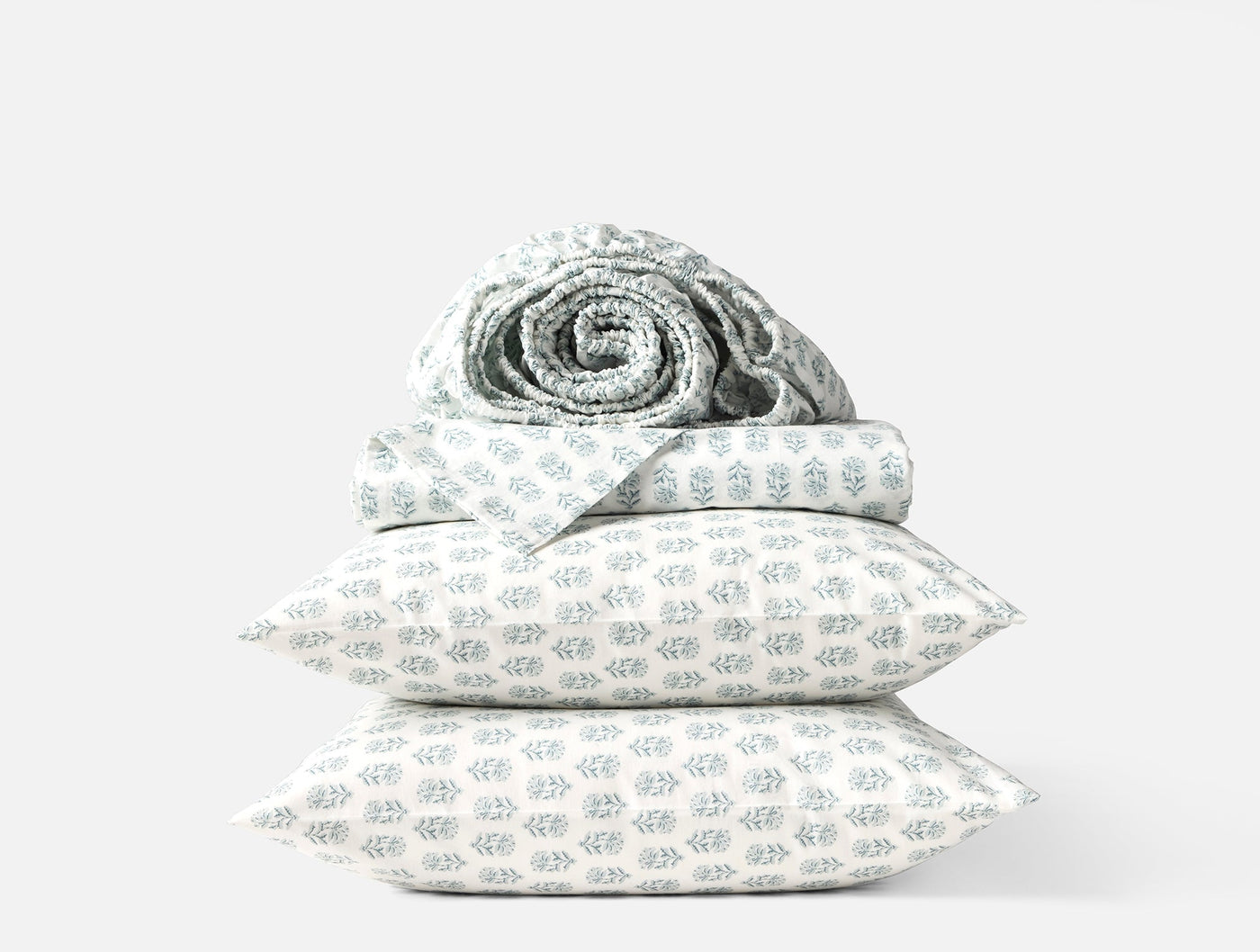 Coyuchi Print Percale pillowcase pair, white with sage botanical print, stacked set.