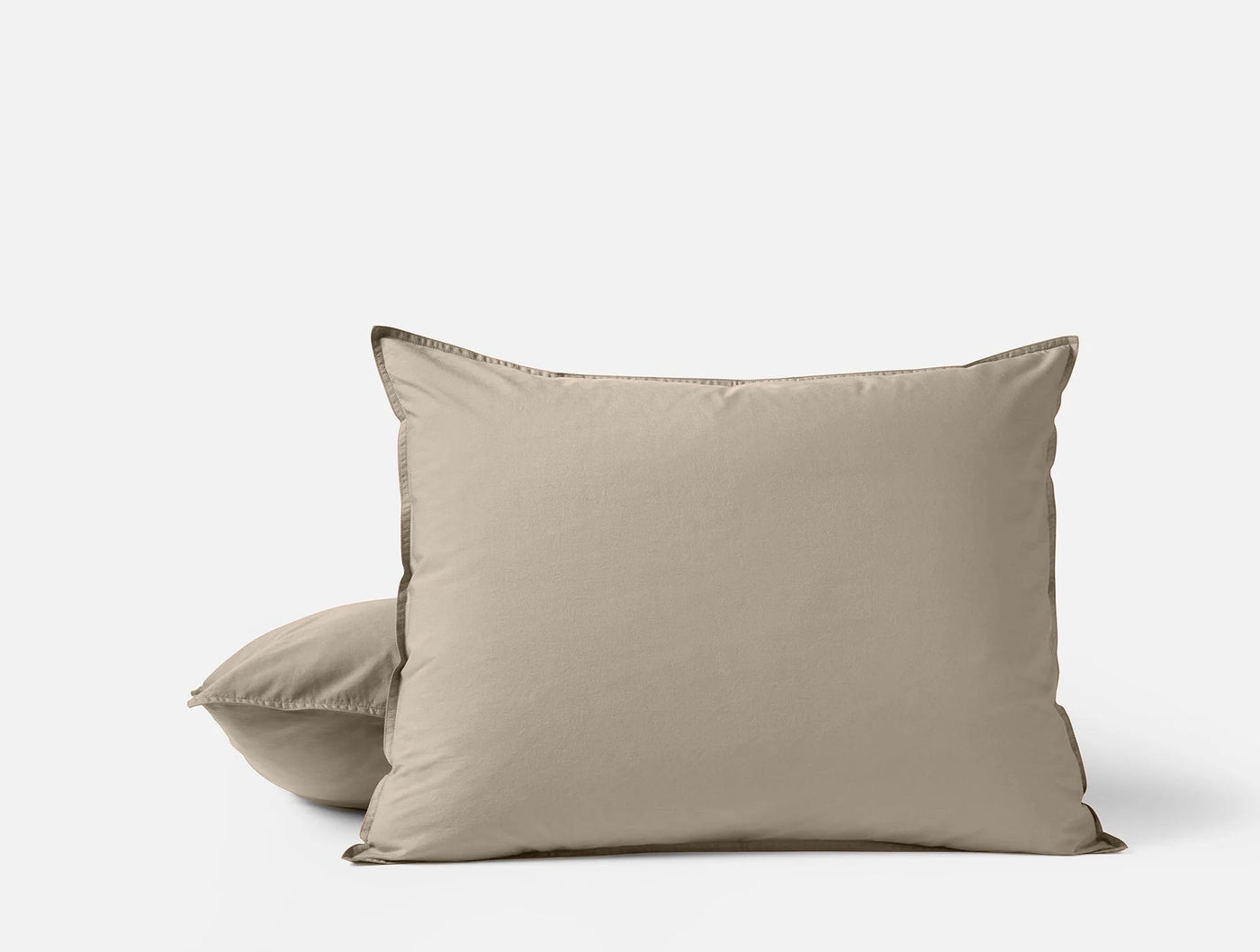 Pair of Coyuchi Crinkled Percale pillowcases in taupe, stacked against white background.