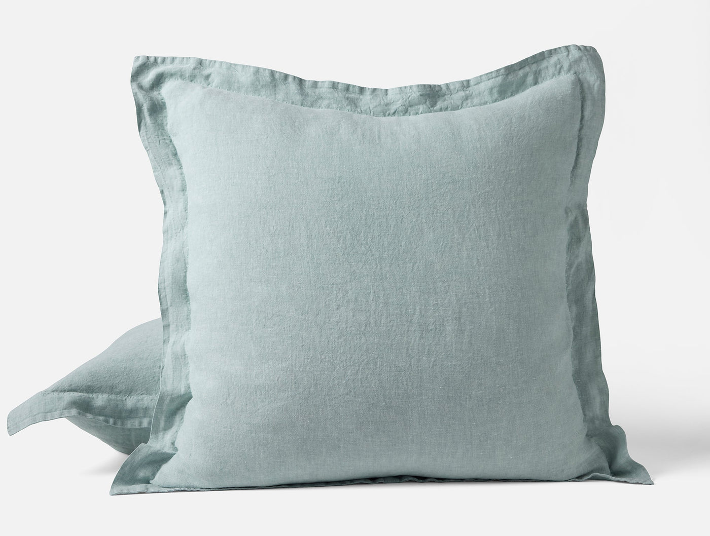 Coyuchi Relaxed Linen sham in seafoam, showing flange edge detail and softly rumpled texture.