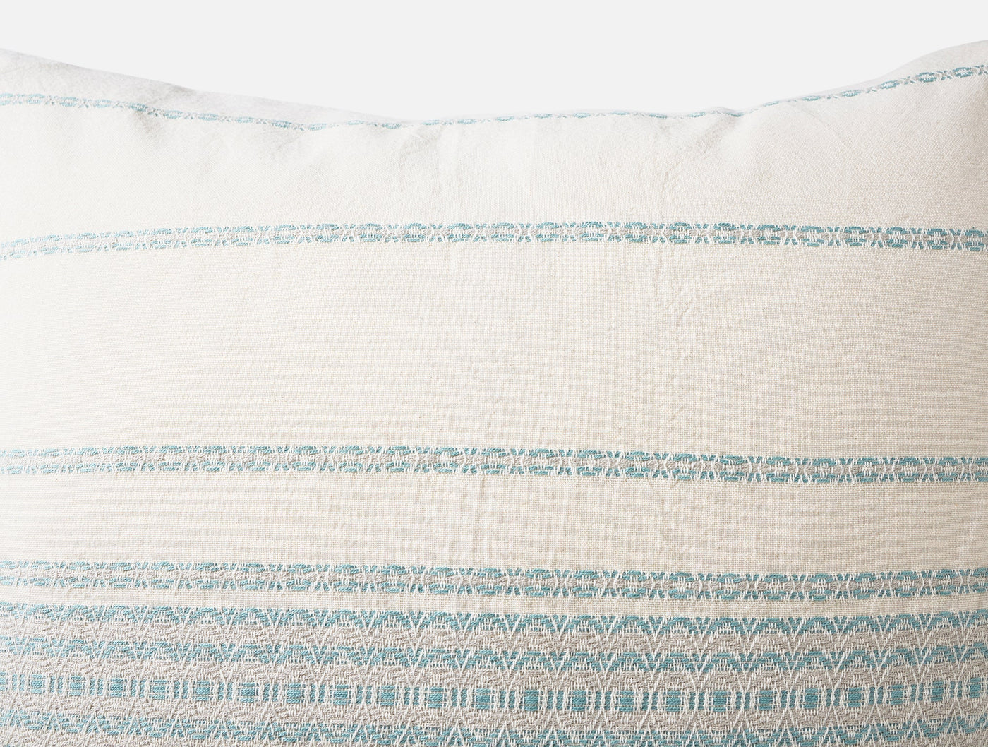 Close-up of Coyuchi Rippled Stripe sham showing aqua woven stripe detail on ivory fabric.