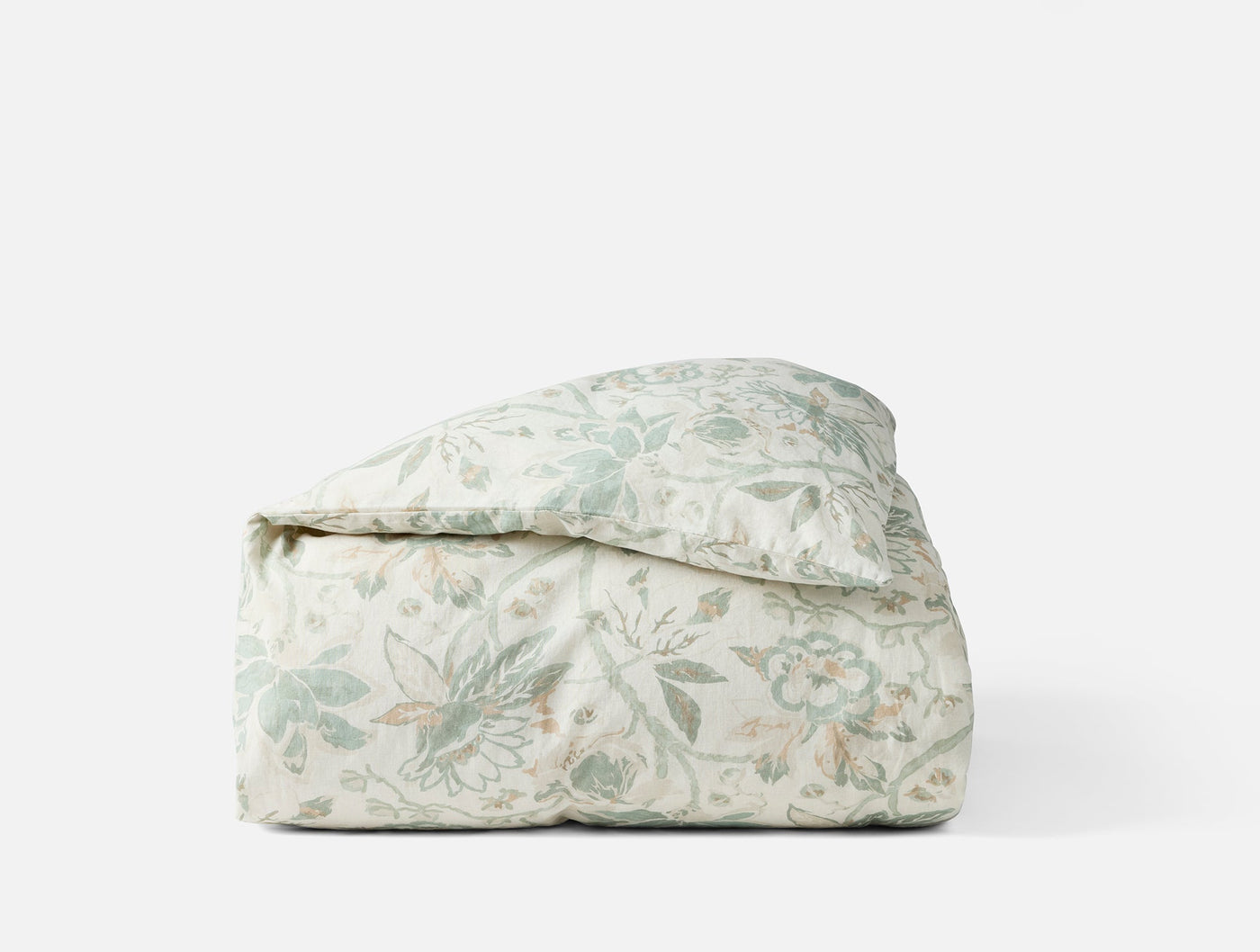 Coyuchi Sea Bloom duvet cover folded, sage floral print on ivory cotton.