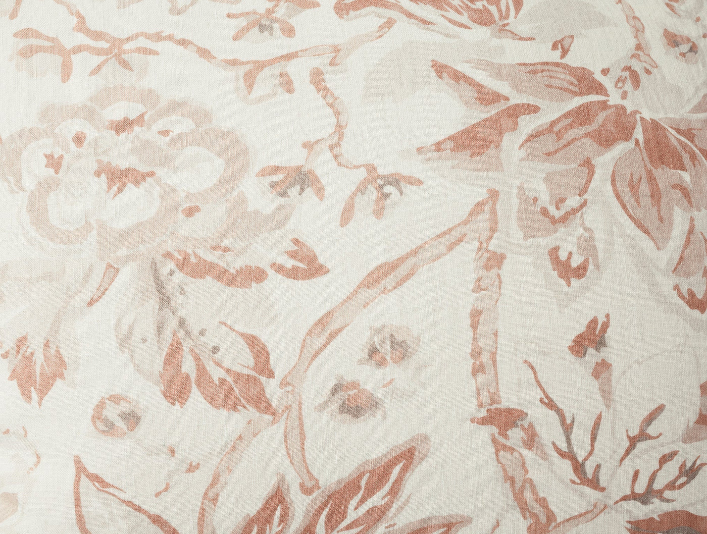 Close-up of Coyuchi Sea Bloom Print sham in blush floral pattern on ivory linen.
