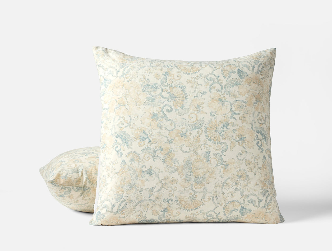 Coyuchi Solana Print pillow sham, ivory with soft blue and sand floral scroll pattern.