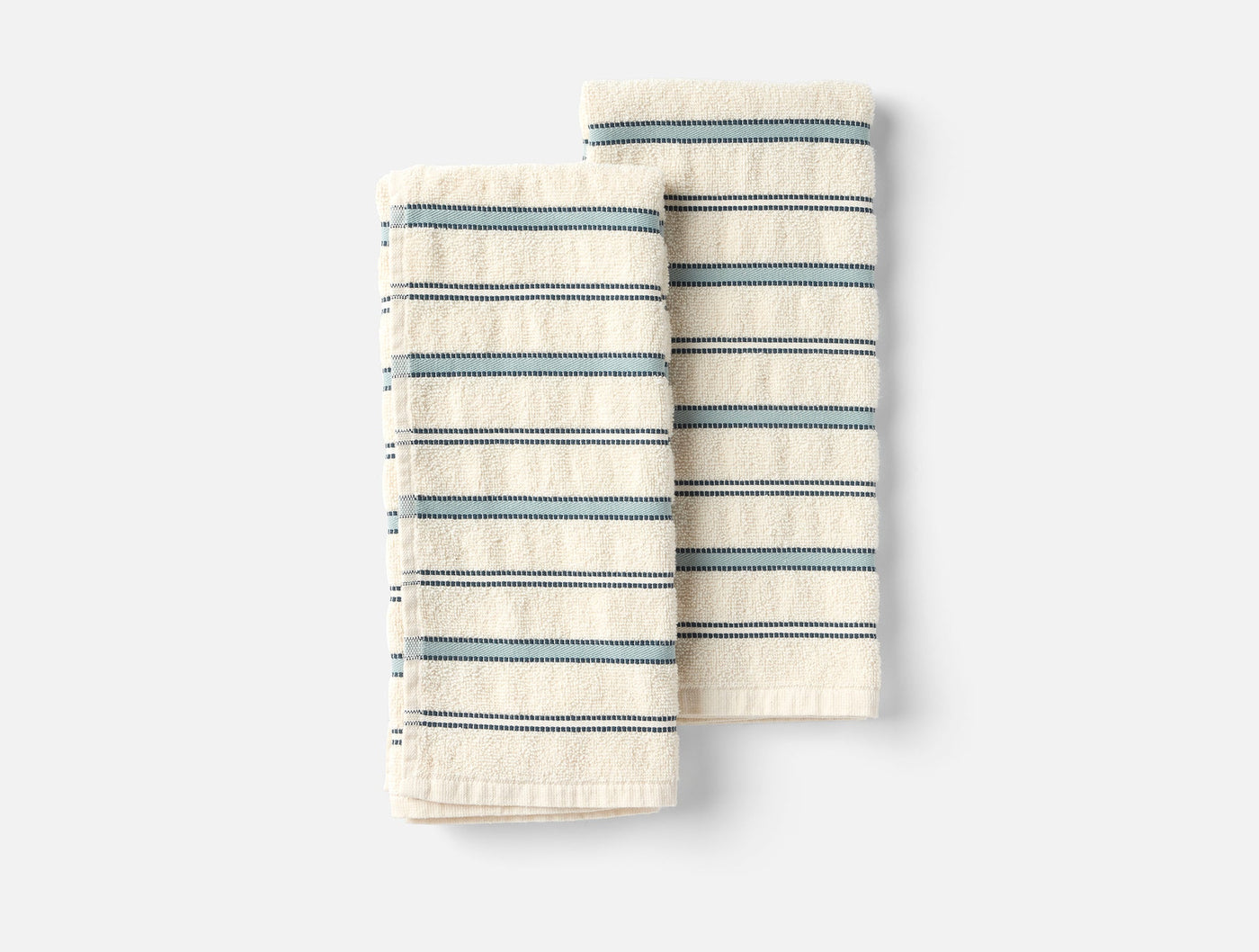 Two folded Coyuchi Acacia hand towels in ivory with blue multi-stripe pattern.