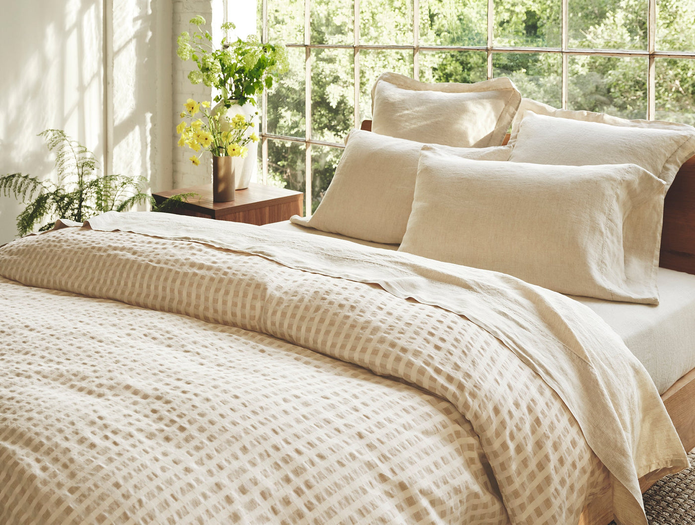 Coyuchi Birch duvet cover in natural, waffle texture detail with linen pillow shams.