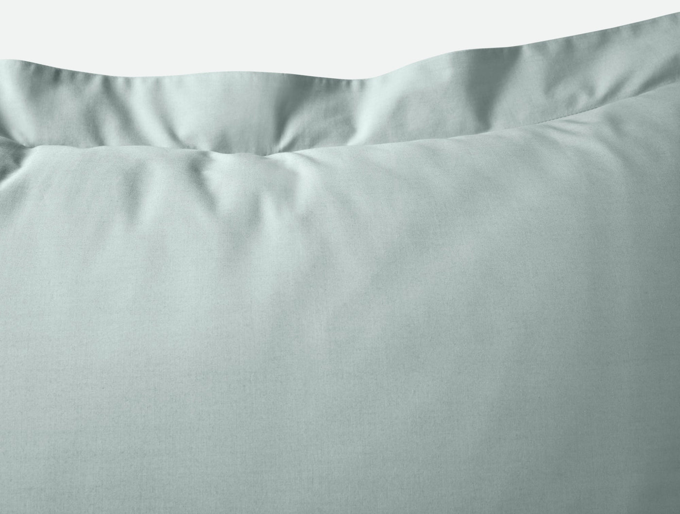 Close-up of Coyuchi Refined Percale sham in sage, showing crisp percale weave and ruffled edge detail.