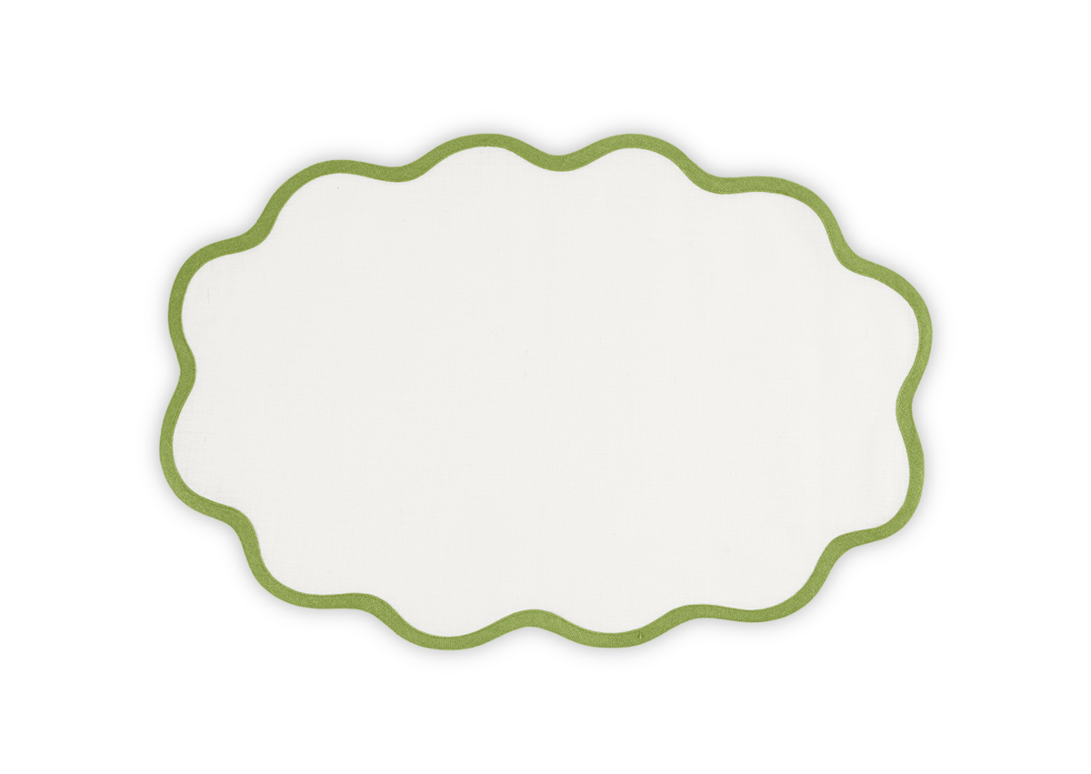 The Matouk Scallop Edge Placemat Set features white linen with a green scalloped border, ideal for adding a unique touch to your tablescape. Shown on a plain background.